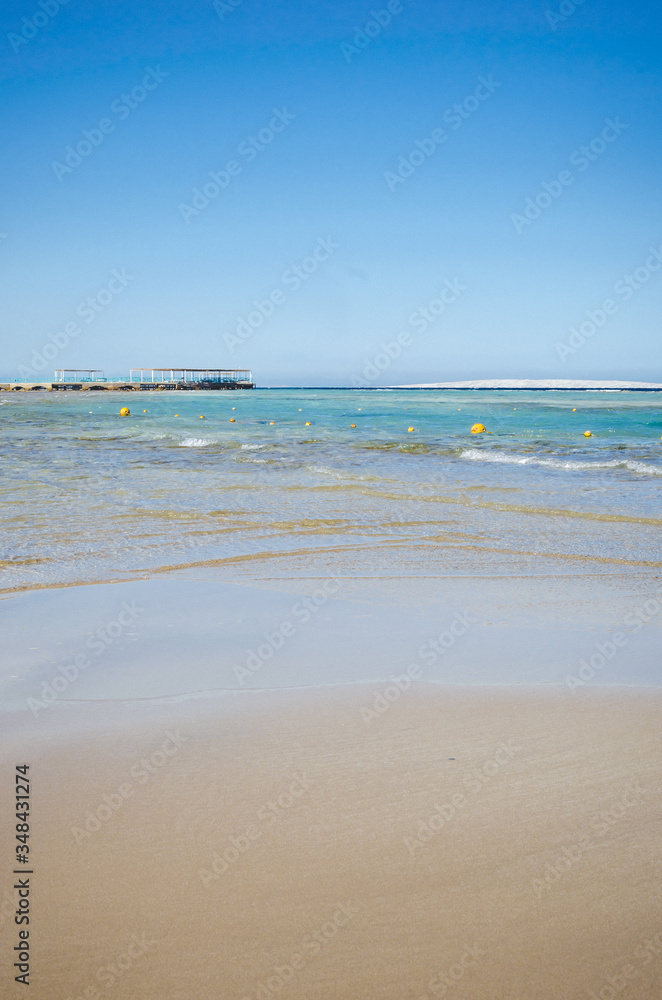 beautiful seascape of an empty sand beach with blue skies/Empty summer beach on the sea and sunny sky