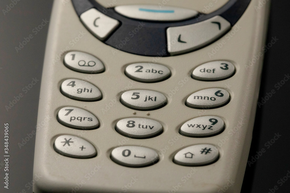 Cell phone pads. Buttons of old phone close-up Cell phone pads. Buttons of old phone close-up