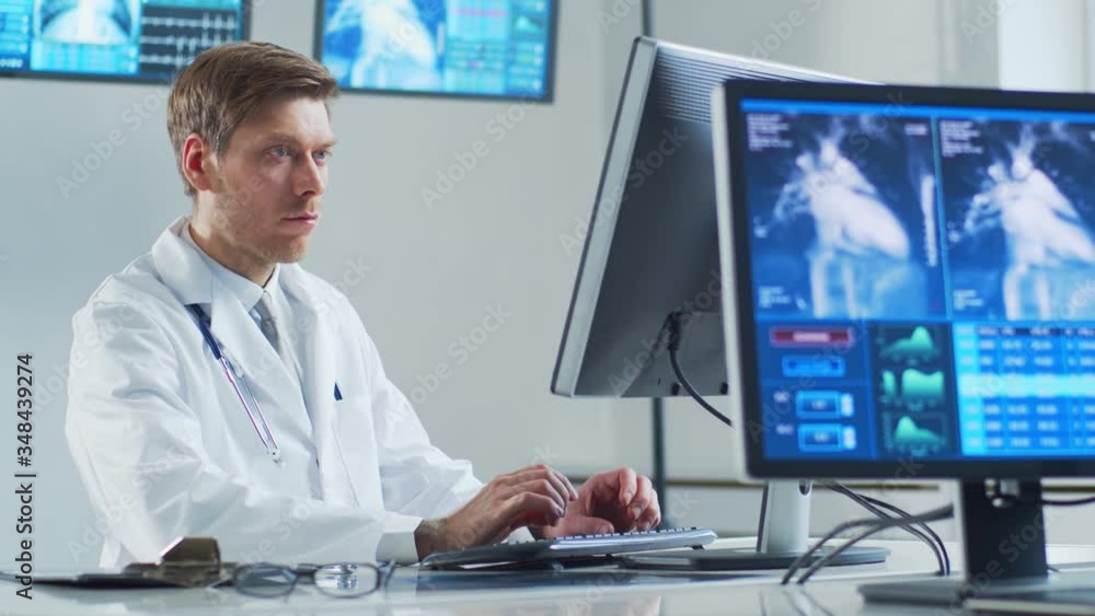 Professional medical doctor working in hospital office using computer technology. Medicine, cardiology and healthcare. Professional medical doctor working in hospital office using computer technology. Medicine, cardiology and healthcare.