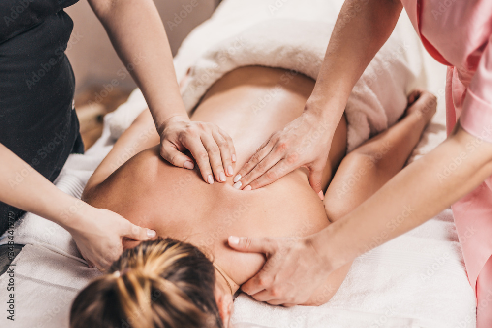 Treatment of pain in the spine with massage - hands of a masseur on the patient back - manual therapy Treatment of pain in the spine with massage - hands of a masseur on the patient back - manual therapy