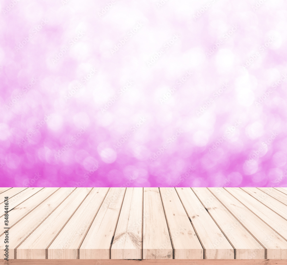 Wood table or wood floor with abstract pink bokeh background for product display Wood table or wood floor with abstract pink bokeh background for product display