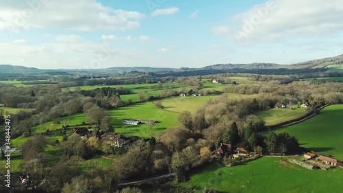 Wallpaper Mural Drone flight over countryside with fresh green fields, forests, houses, farms on a sunny day. Bird's eye view Torontodigital.ca