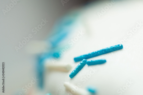 Confectionery industry. Blue decorative pastry topping, macro shot.