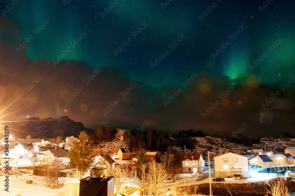 Northern lights above the highest peaks of Lofoten islands, Norway