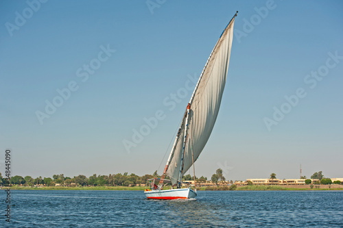 Traditional egyptian felluca sailing boat on Nile