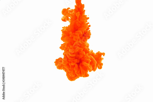 Abstract orange color ink in water isolated on white background