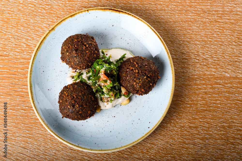 Falafel is a deep-fried ball, or a flat or doughnut-shaped patty, made from ground chickpeas Falafel is a deep-fried ball, or a flat or doughnut-shaped patty, made from ground chickpeas