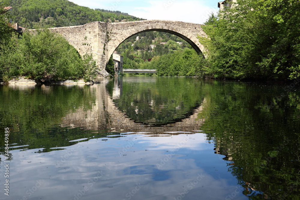 old bridge over the river in Le Vigan, France