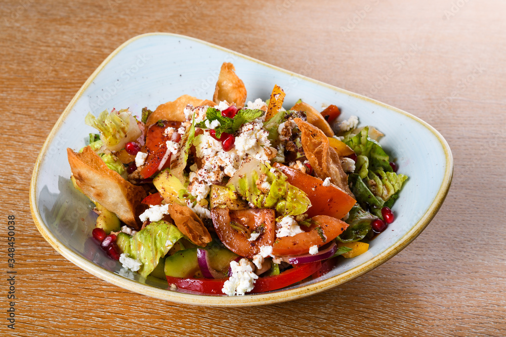 Fattoush is a Levantine salad made from toasted or fried pieces of khubz combined with mixed greens Fattoush is a Levantine salad made from toasted or fried pieces of khubz combined with mixed greens