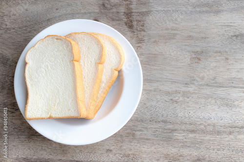 bread on a plate on a wooden table