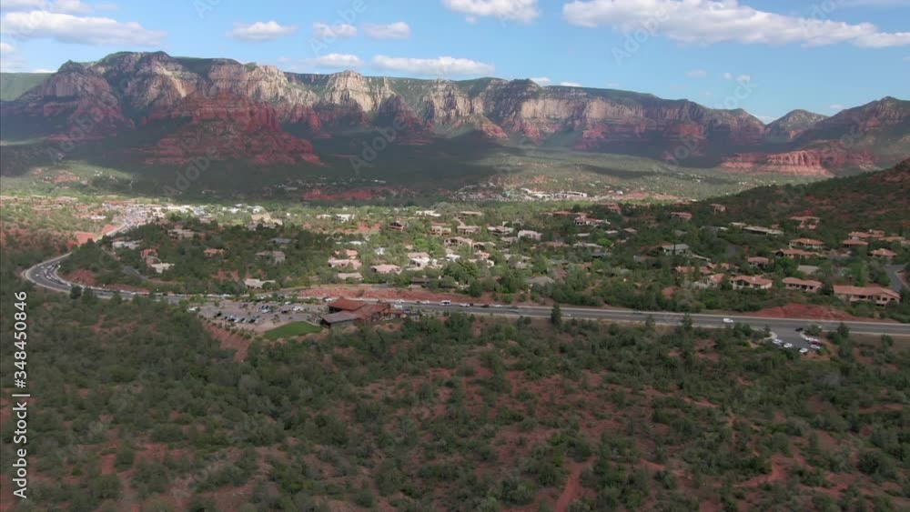 Sedona, Arizona, USA. Aerial flying over suburbs & red-rock buttes, mountains & desert Sedona, Arizona, USA. Aerial flying over suburbs & red-rock buttes, mountains & desert