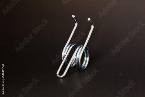 spring and wire forming for industrial use on black background.