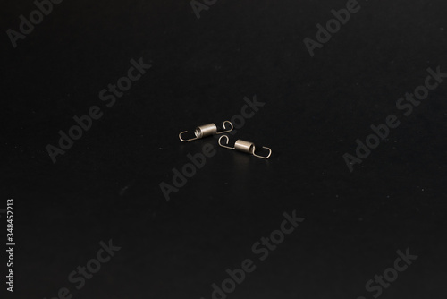 spring and wire forming for industrial use on black background.