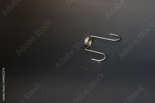 spring and wire forming for industrial use on black background.