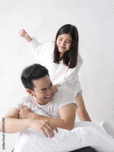 Asian family fight. Furious wife hurt husband after unfaithful, motion blur.
