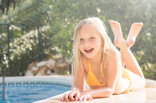 Принти на полотні Summertime fun. Happy girl in pool in sunny day. Vacations.