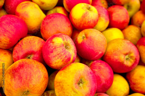 pink and yellow apples on the market