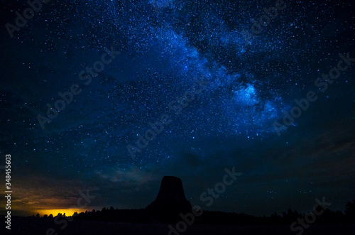 beautiful devil tower at night with milkyway in the clear sky. wyoming,usa.