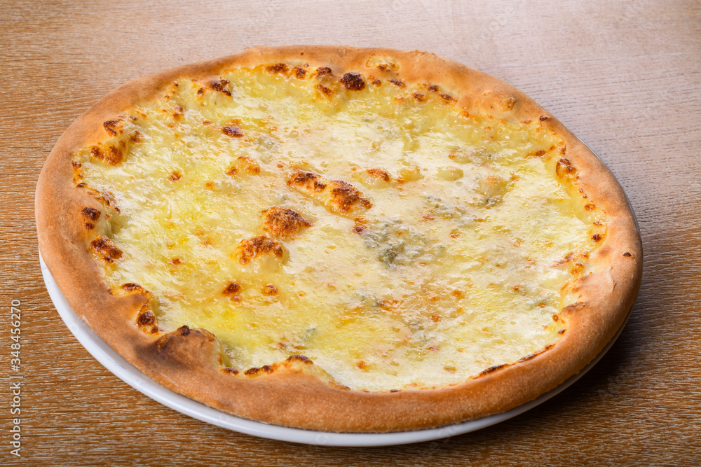 Quattro formaggi is a variety of Italian pizza topped with: mozzarella, gorgonzola, parmesan Quattro formaggi is a variety of Italian pizza topped with: mozzarella, gorgonzola, parmesan