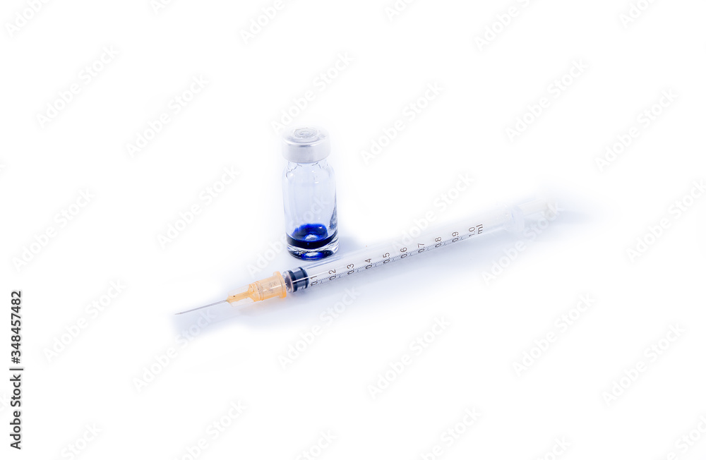 Multicolored pills in a white bottle, isolated on a white background. Multicolored pills in a white bottle, isolated on a white background.