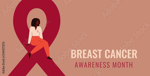 Breast cancer awareness and prevention month banner. A black woman sits on a big pink ribbon. The concept of support and solidarity with women fighting oncological disease. Vector illustration