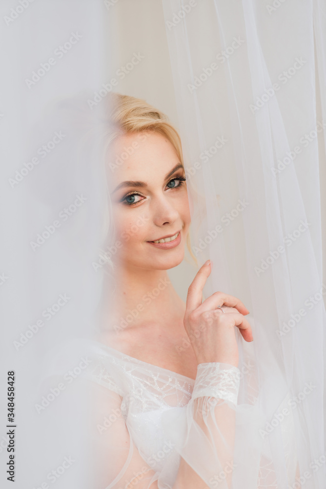 Conceptual wedding, the morning of the bride in the European style. Boudoir dress, fees in the interior Studio. White minimalism for the bride Conceptual wedding, the morning of the bride in the European style. Boudoir dress, fees in the interior Studio. White minimalism for the bride