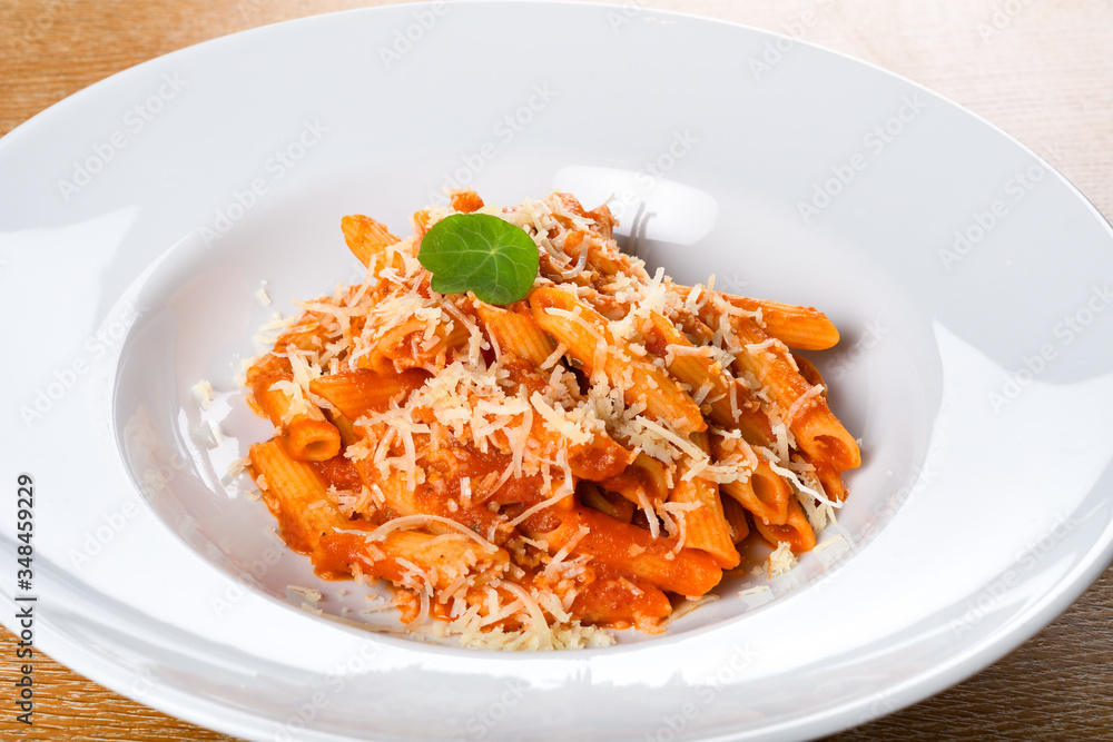 Italian spicy penne arrabiata or pasta al'arrabiata. Arrabbiata sauce is a spicy sauce for pasta Italian spicy penne arrabiata or pasta al'arrabiata. Arrabbiata sauce is a spicy sauce for pasta