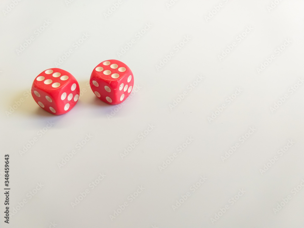 Dice of red color with white dots with a successful combination are isolated on a white background. Great space for text. Good luck in the game. Victory concept. Gambling concept Dice of red color with white dots with a successful combination are isolated on a white background. Great space for text. Good luck in the game. Victory concept. Gambling concept