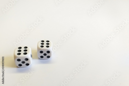 Dice in white with black dots with a successful combination isolated on a white background. Great space for text. Good luck in the game. Victory concept. Gambling concept