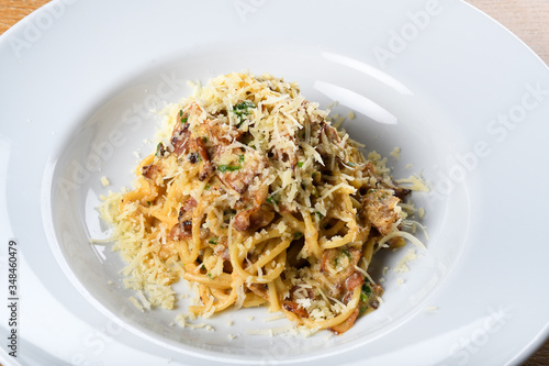 Spaghetti carbonara, specific authentic traditional italian: bacon, egg, parmesan shavings