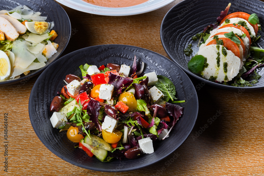 Greek salad or horiatiki salad is a salad in Greek cuisine. Greek salad is made with tomatoes Greek salad or horiatiki salad is a salad in Greek cuisine. Greek salad is made with tomatoes
