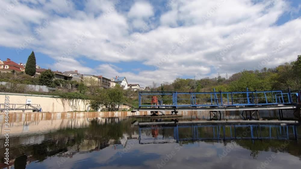 Working treatment facilities. Reflection of the blue sky in the water. Working treatment facilities. Reflection of the blue sky in the water.