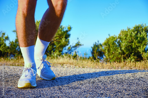 legs of man during morning jogging in the countryside
