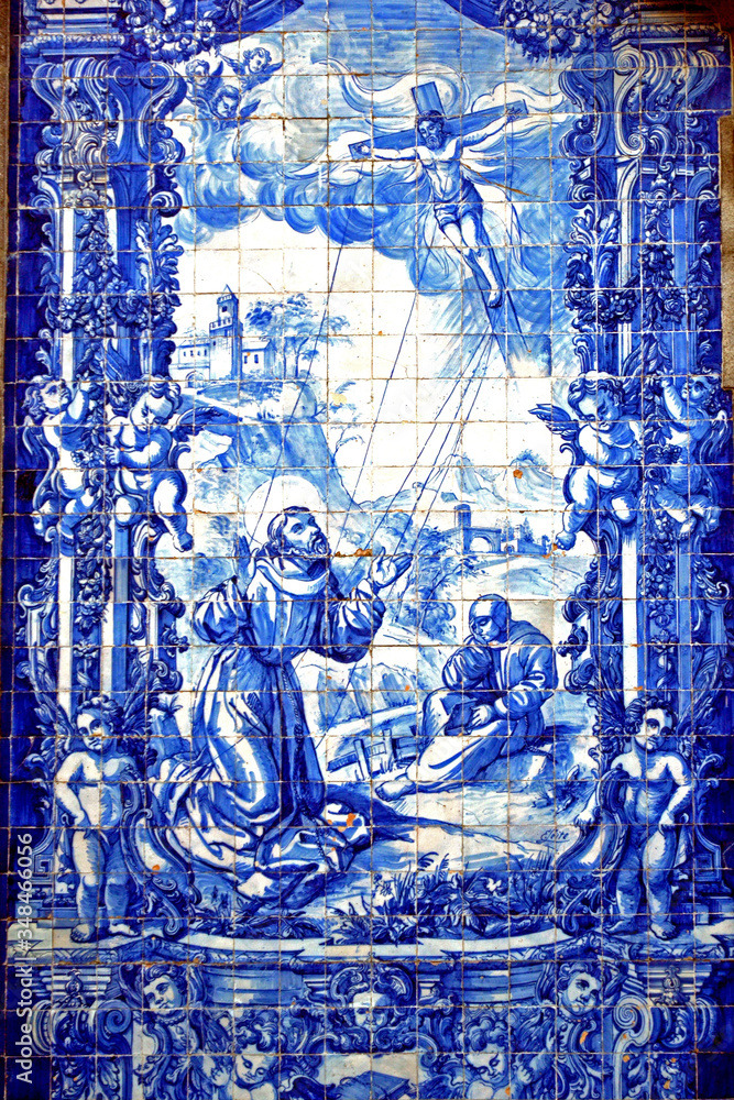 Porto, Portugal - August 17, 2015: Focus the church la Capela das Almas. Its facade is covered with Azulejos. The tiles show the lives of Saint Catherine and Saint Francis of Assisi.