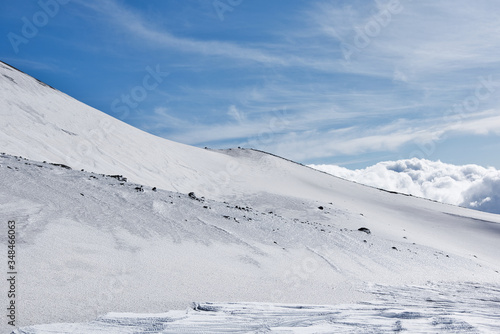 Snowy side of a volcano mountain in Sicily
