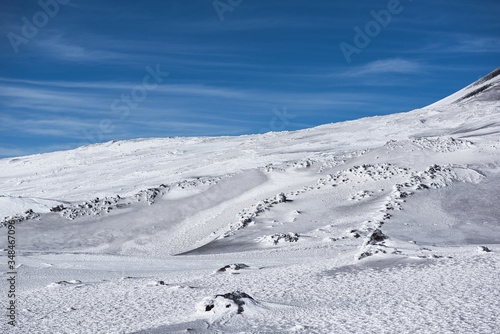 Snowy side of a volcano mountain in Sicily