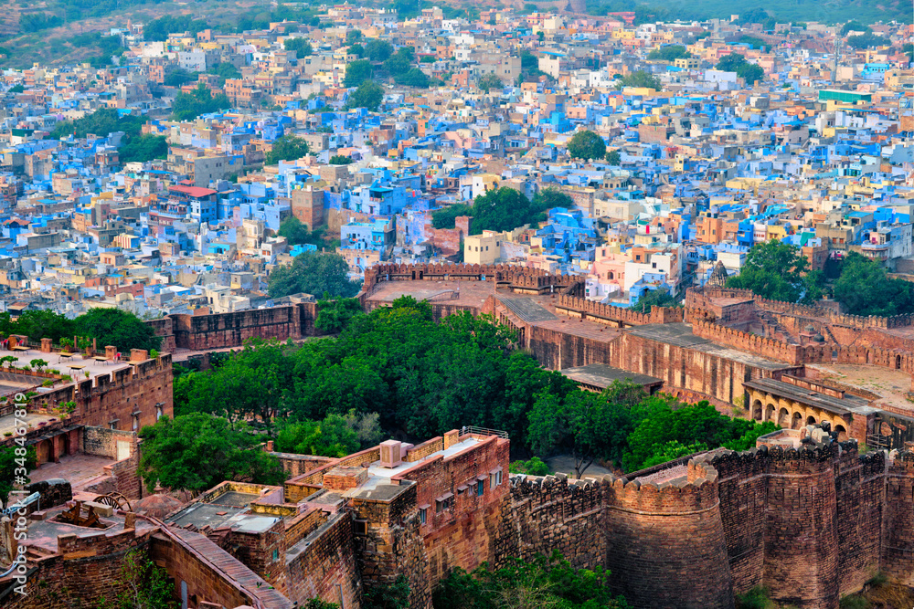 Aerial view of Jodhpur, also known as Blue City due to the vivid blue-painted Brahmin. View from Mehrangarh Fort (part of fortifications is also visible). Jodphur, Rajasthan, India