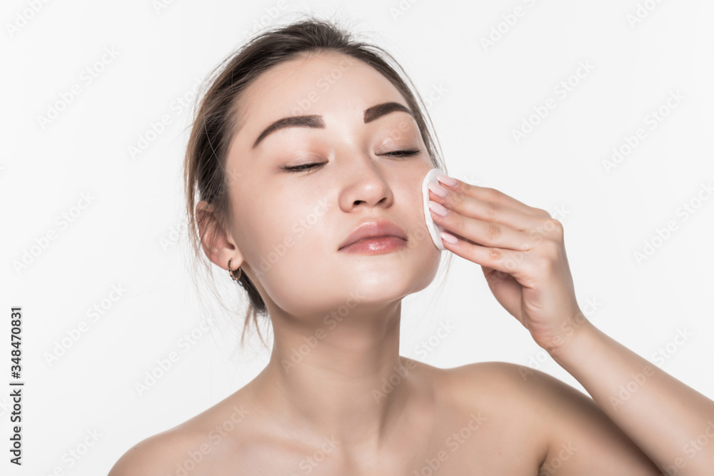 Young attractive asian woman beauty use sponge isolated on white background