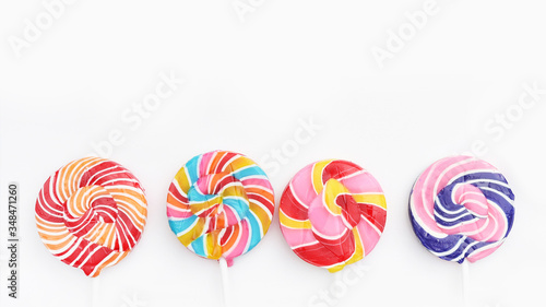 close up of colorful lollipops isolated on white background