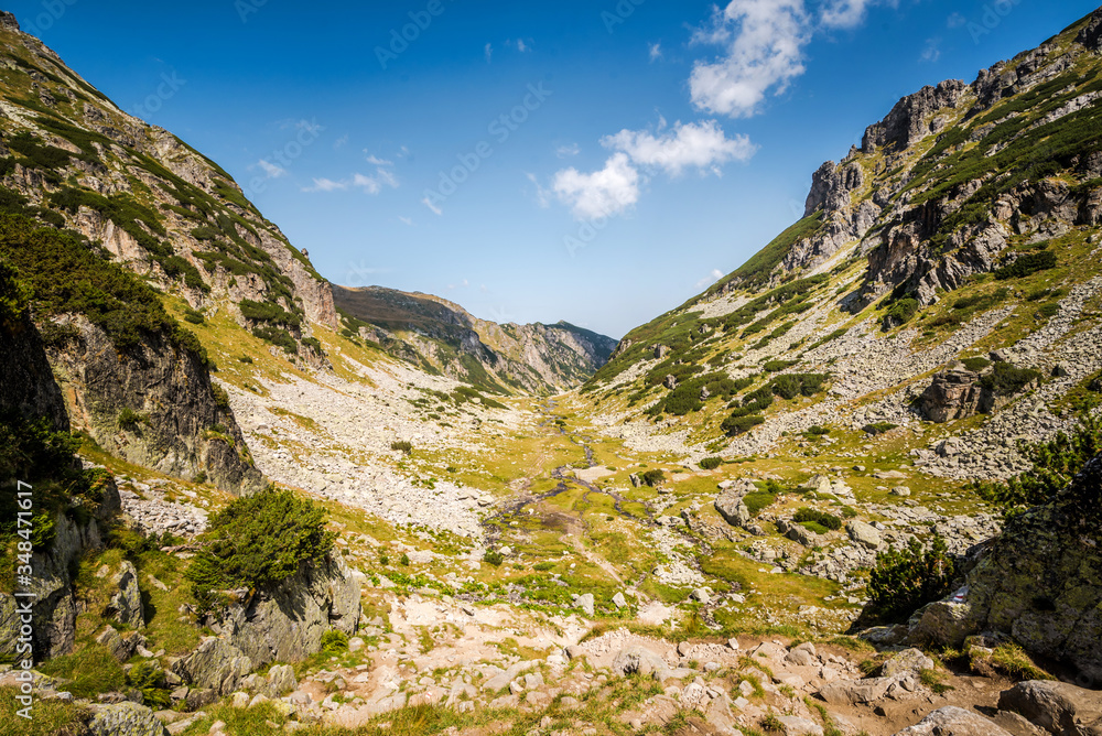 Beautiful mountain scenery in a sunny summer day. Rila mountain, Bulgaria. Hiking/ trekking concept. Beautiful mountain scenery in a sunny summer day. Rila mountain, Bulgaria. Hiking/ trekking concept.