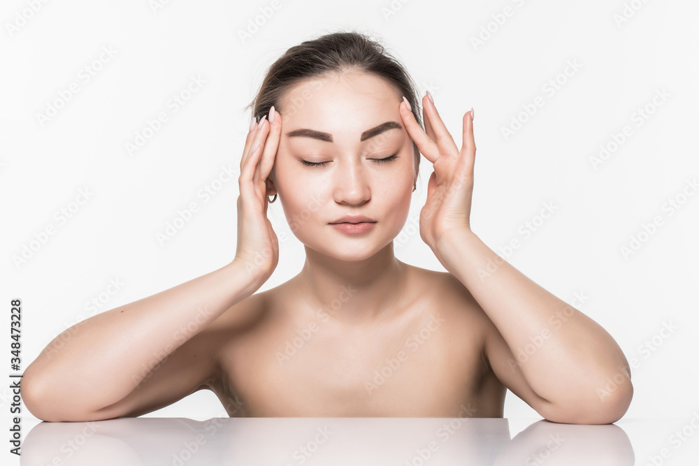 Closeup portrait of young woman face skin care with cosmetics isolated on white background Closeup portrait of young woman face skin care with cosmetics isolated on white background