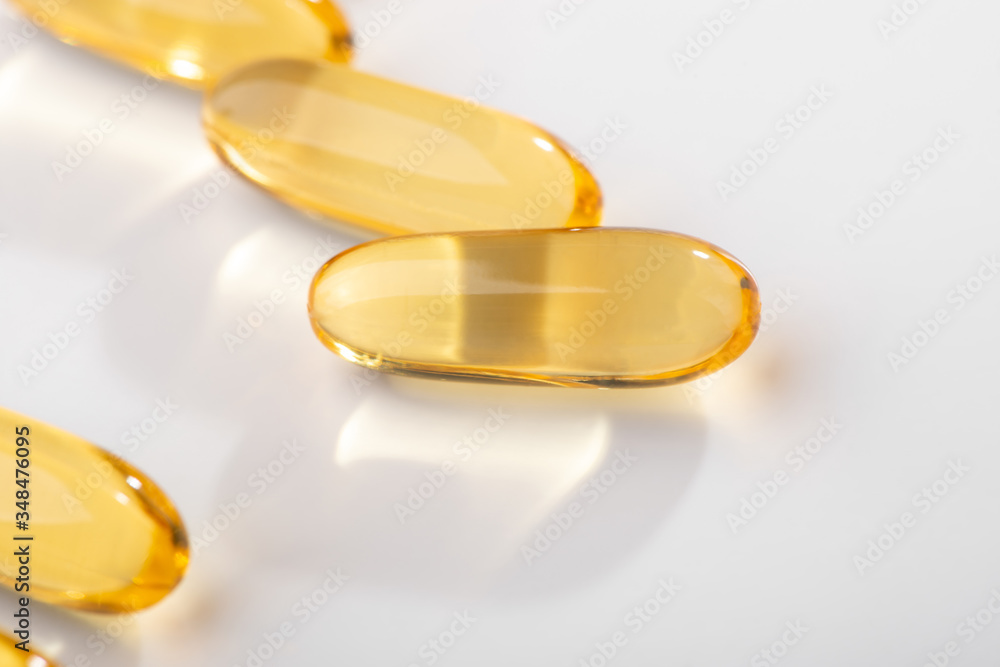 Close-up on Omega-3 fatty acid capsules on white background Close-up on Omega-3 fatty acid capsules on white background