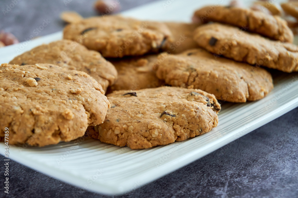 Close up on a bunch of peanut butter cookies in white plate healthy and natural homemade peanut butter gluten-free cookies Close up on a bunch of peanut butter cookies in white plate healthy and natural homemade peanut butter gluten-free cookies