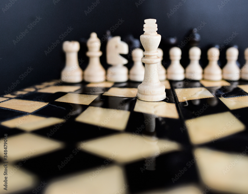 chess on a chessboard is reflected in spilled water chess on a chessboard is reflected in spilled water