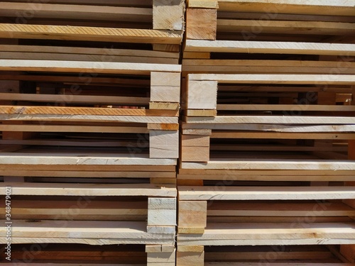 Stacked wooden pallets as background texture or backdrop