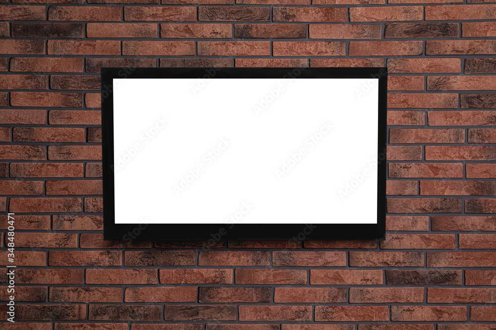 Modern TV on brick wall. Space for design Modern TV on brick wall. Space for design