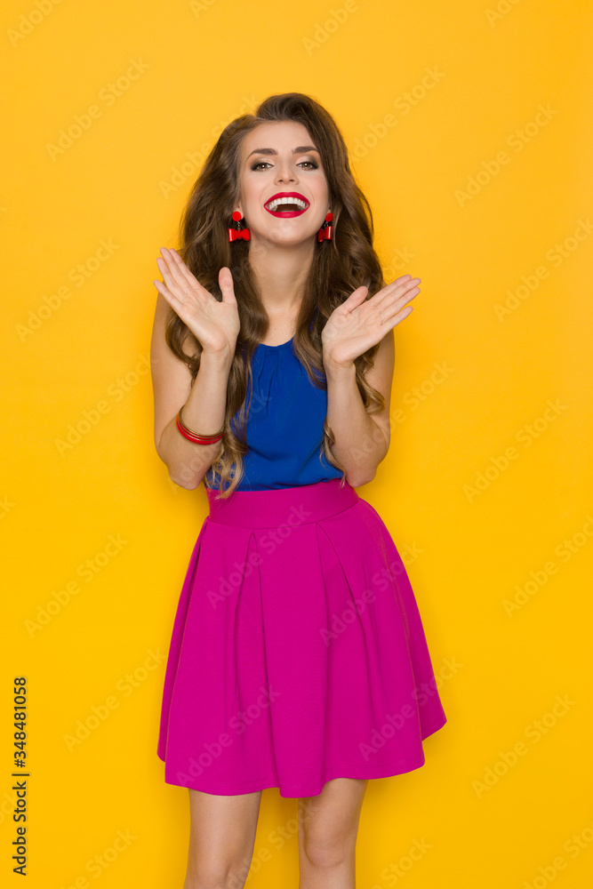 Woman In Colorful Clothes Is Laughing And Gesturing