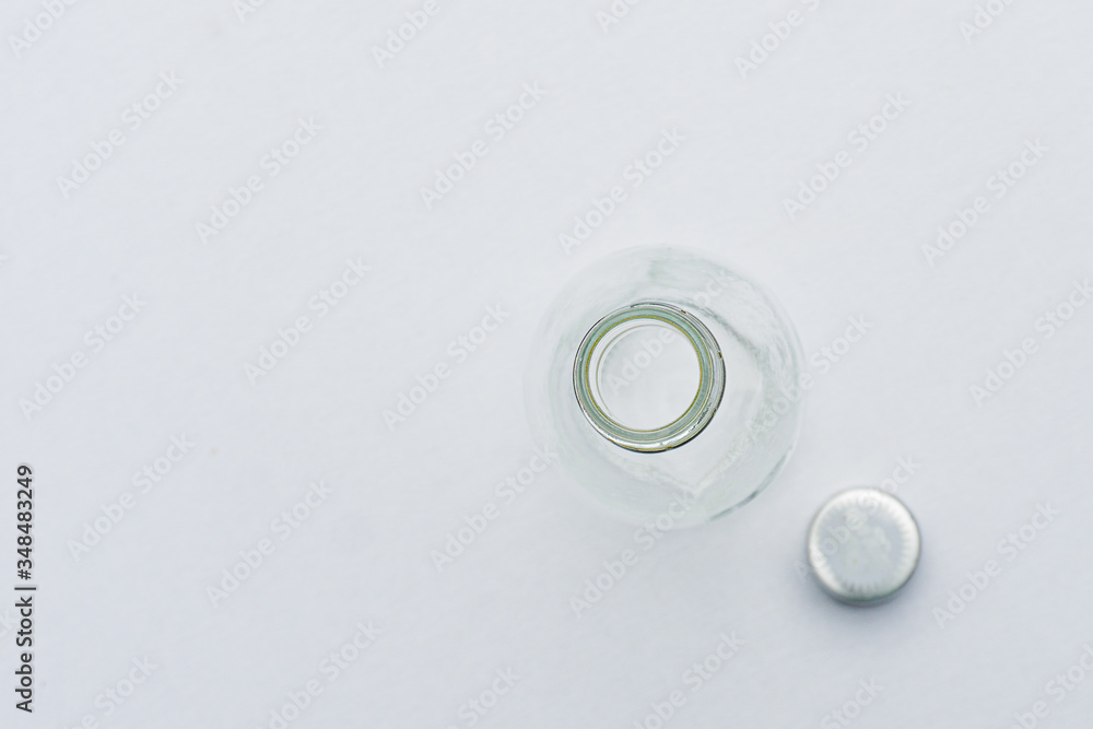 top view of a glass water bottle isolated on white for background. top view of a glass water bottle isolated on white for background.