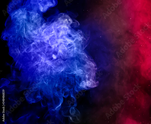 red and blue colorful smoke on dark background