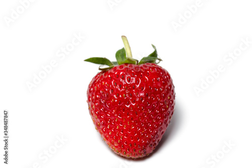 Strawberries are arranged in different styles on a white background.